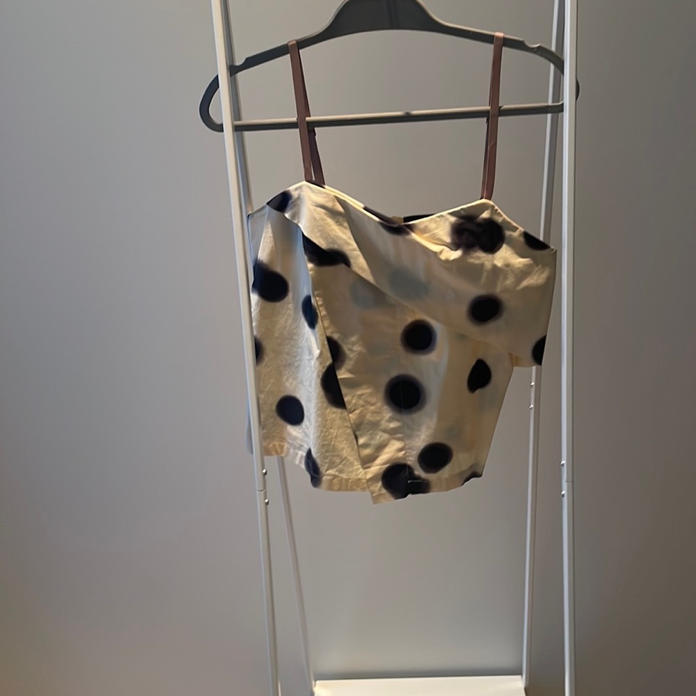 Yellow and Black polka dots. Size 4 but fits like a 6